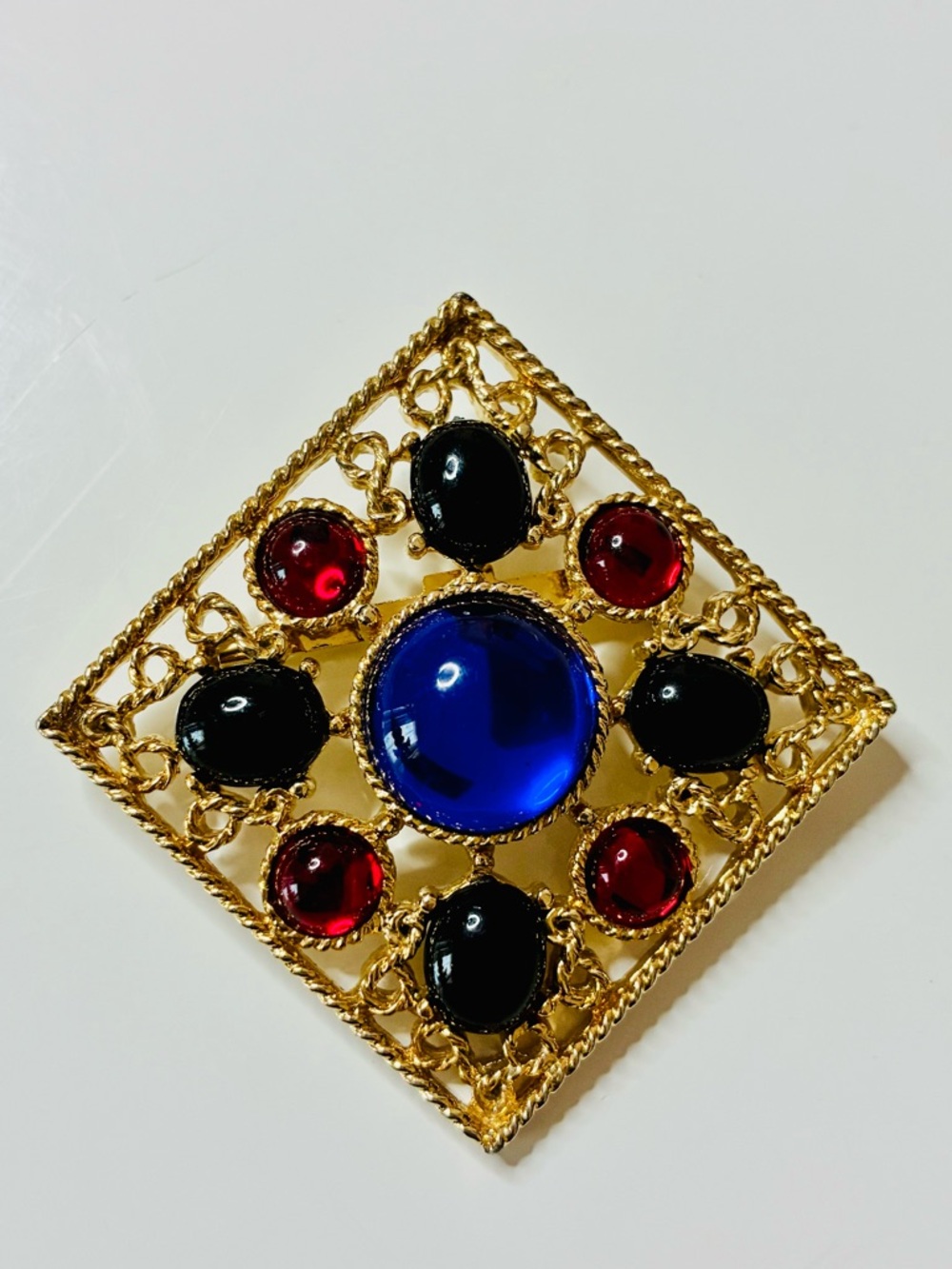Bold Gold-Tone Brooch with Royal Blue Center and Black & Red Accents